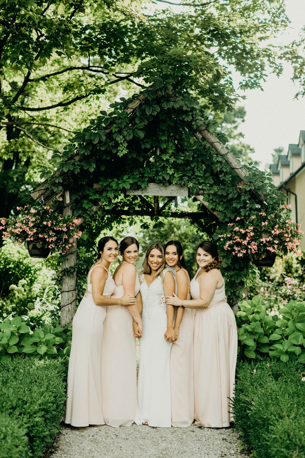 garden wedding with bridesmaids in blush