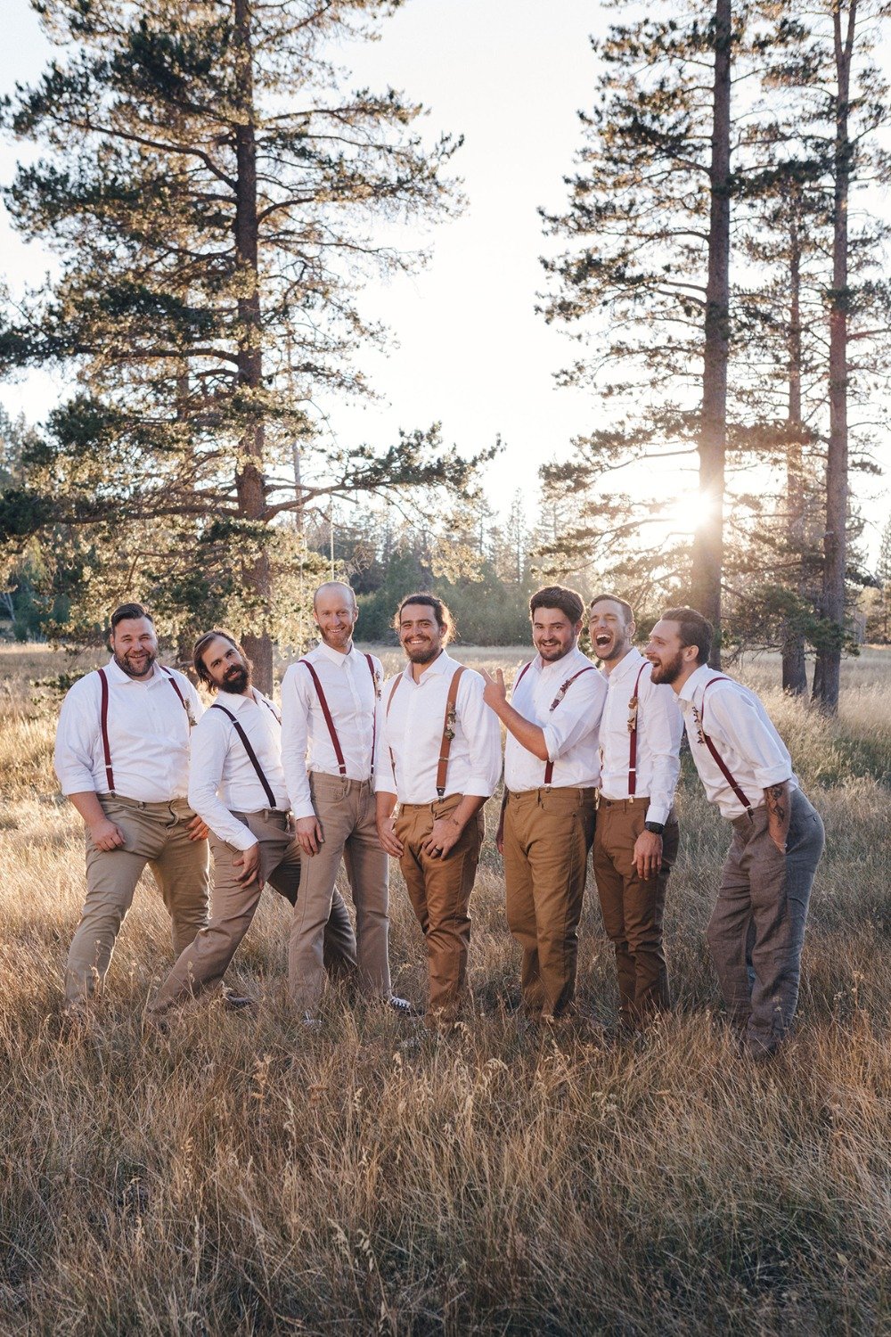groom and his men in tan jeans and suspenders