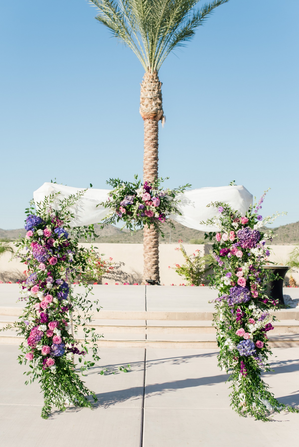 Purple floral wedding arbor
