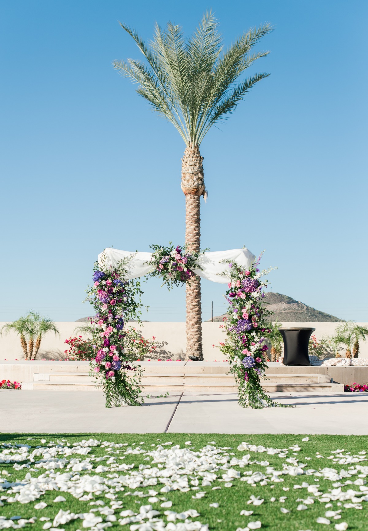 Floral wedding arbor at Chateau Luxe