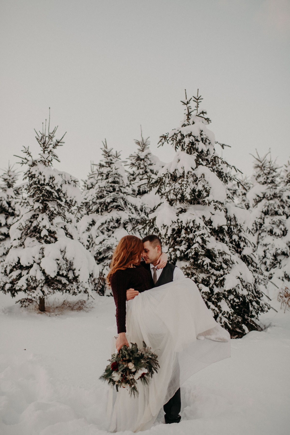 sweet wedding couple in the snow
