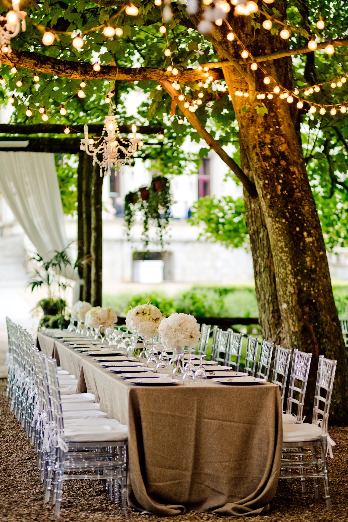 Elegant outdoor wedding table under twinkling lights