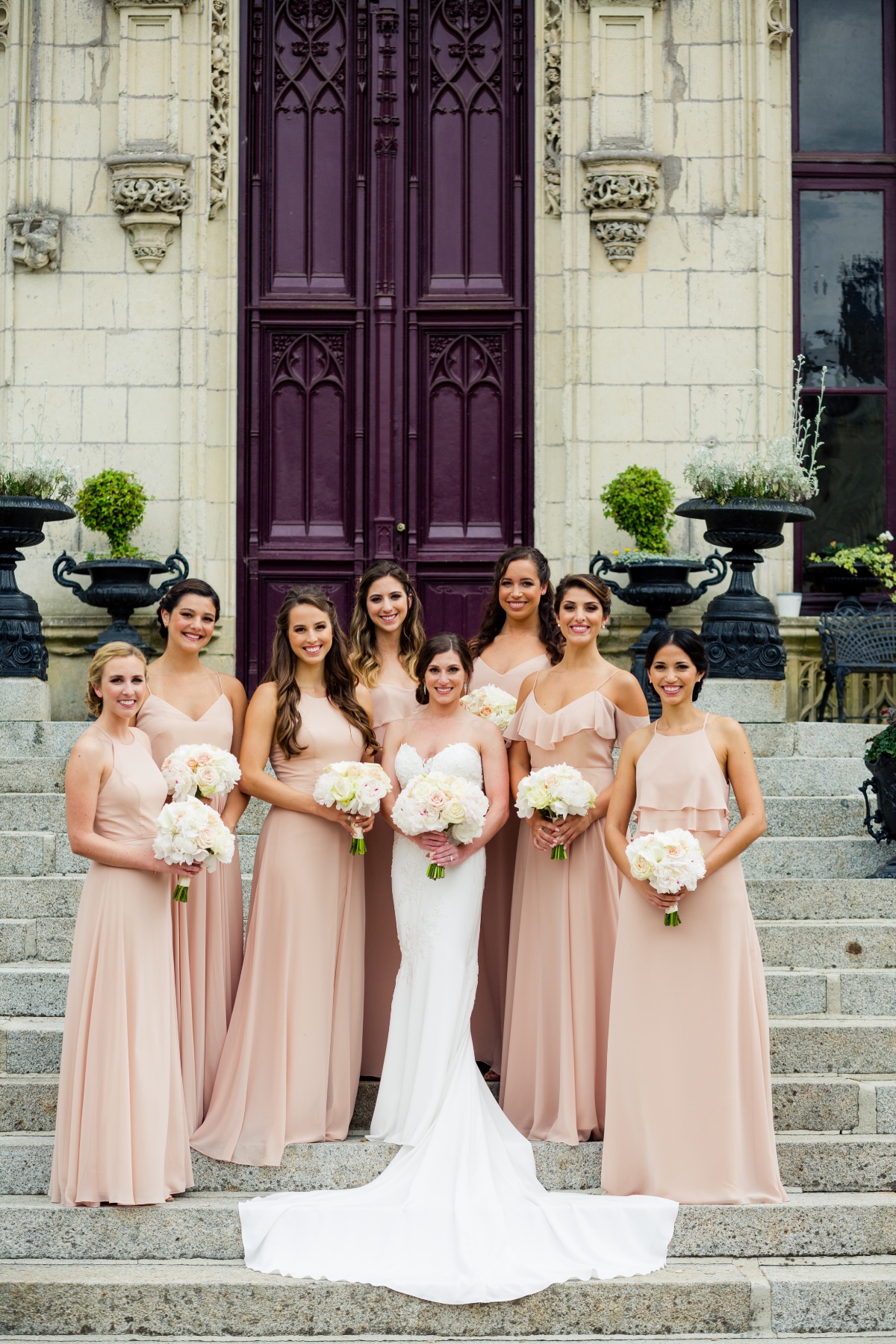 Bride and bridesmaids in pink dresses wedding flowers