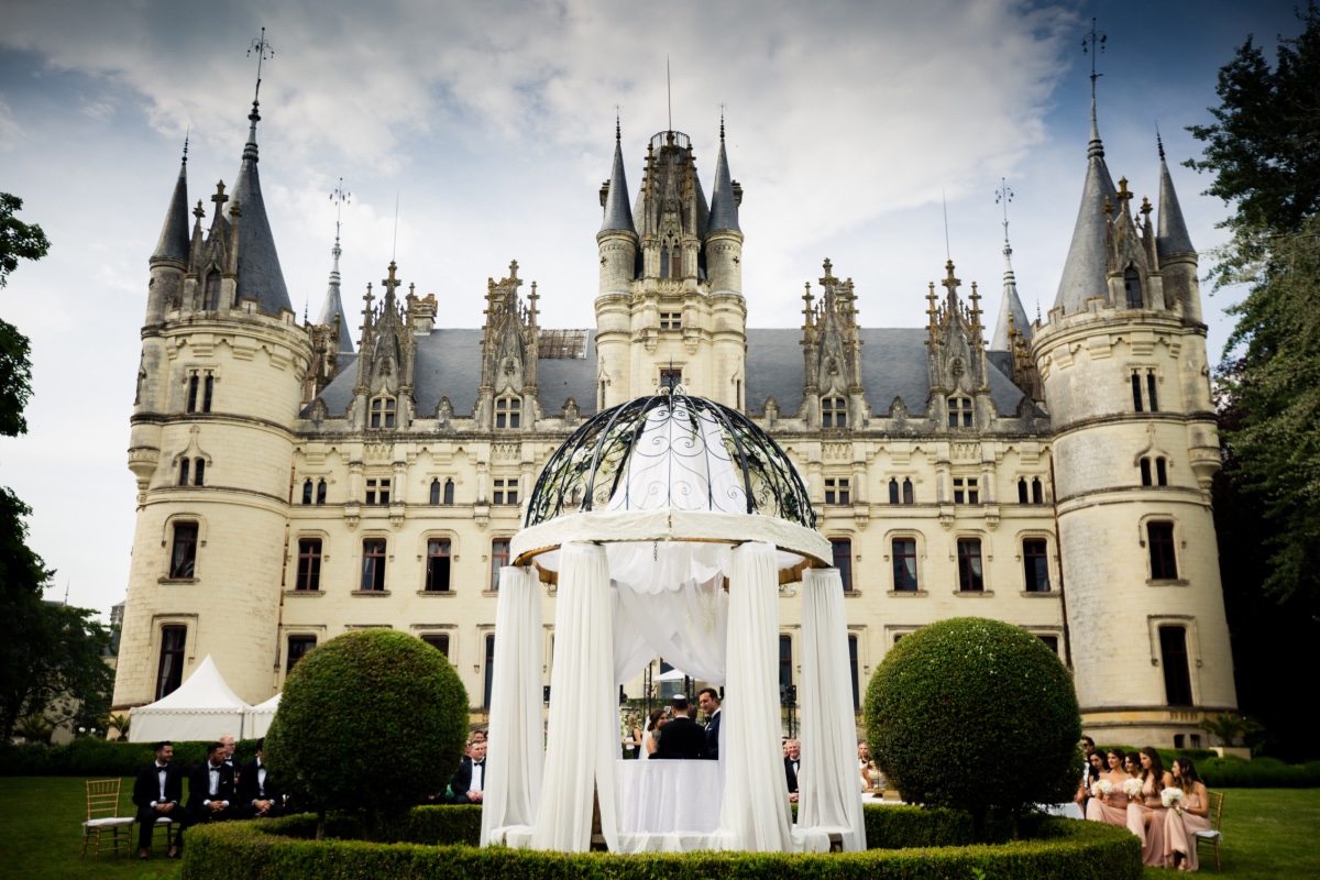 Wedding ceremony with castle in the background, a fairytale wedding