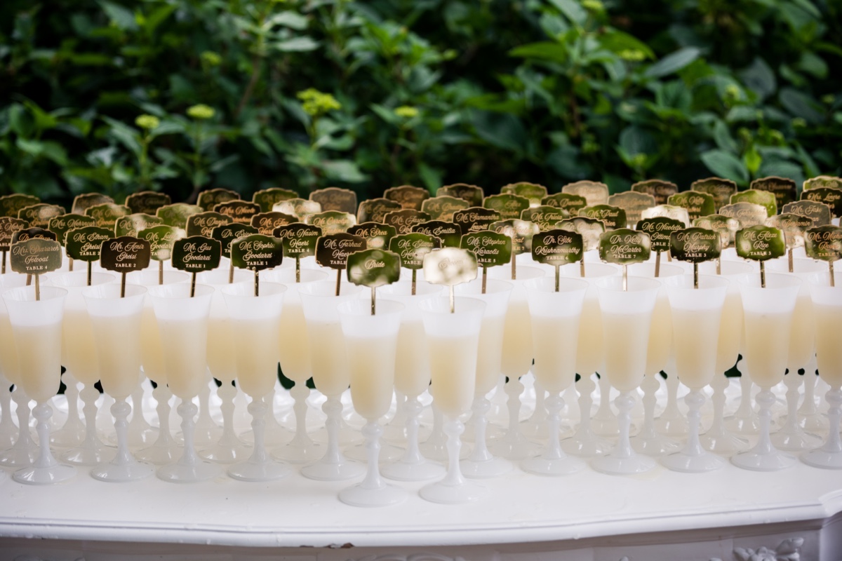 Wedding reception with name tags in drinks, ready for guests