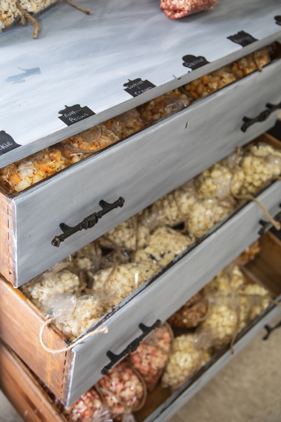Drawers filled with assorted flavored popcorn bags