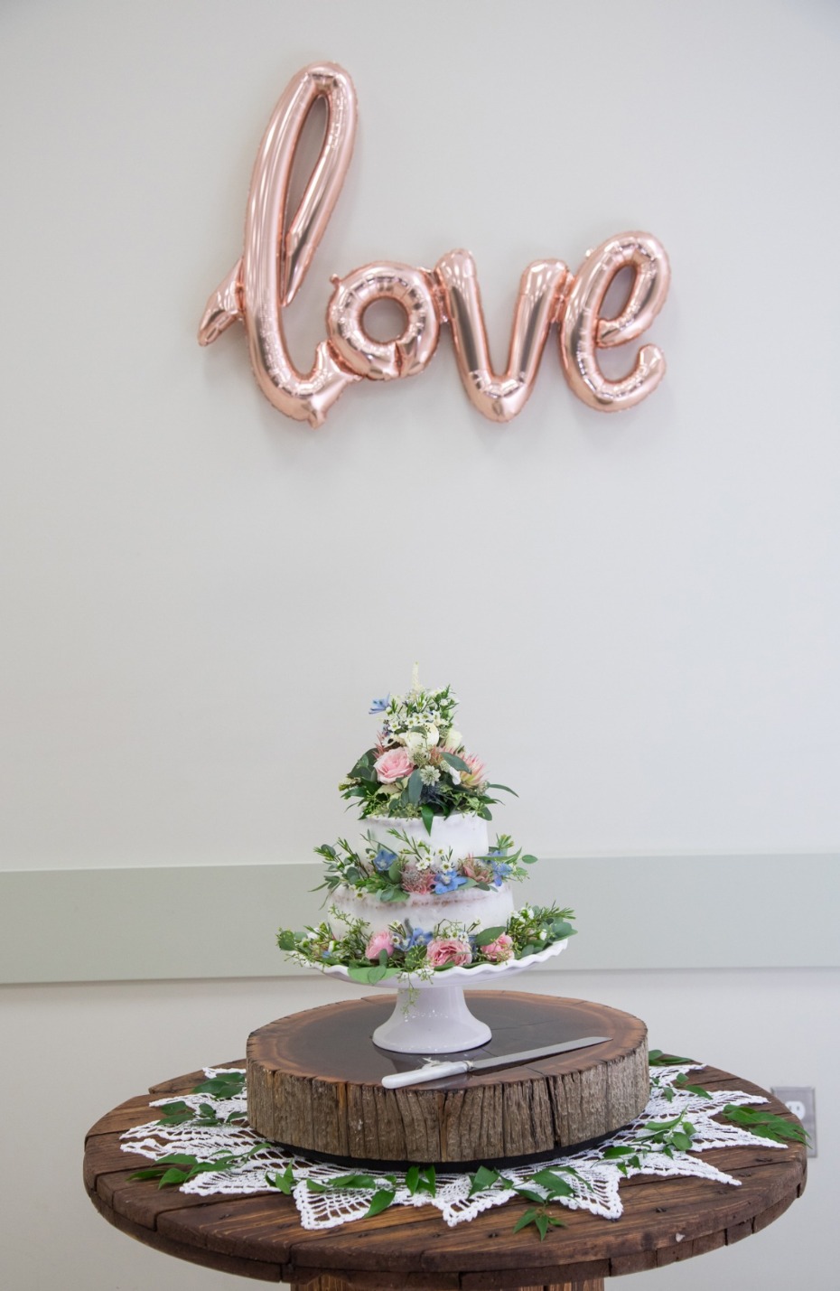 Wedding cake with flowers and love balloon decoration
