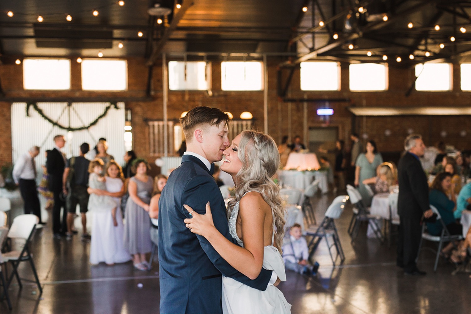 Bride and groom share an intimate moment on the wedding dance floor