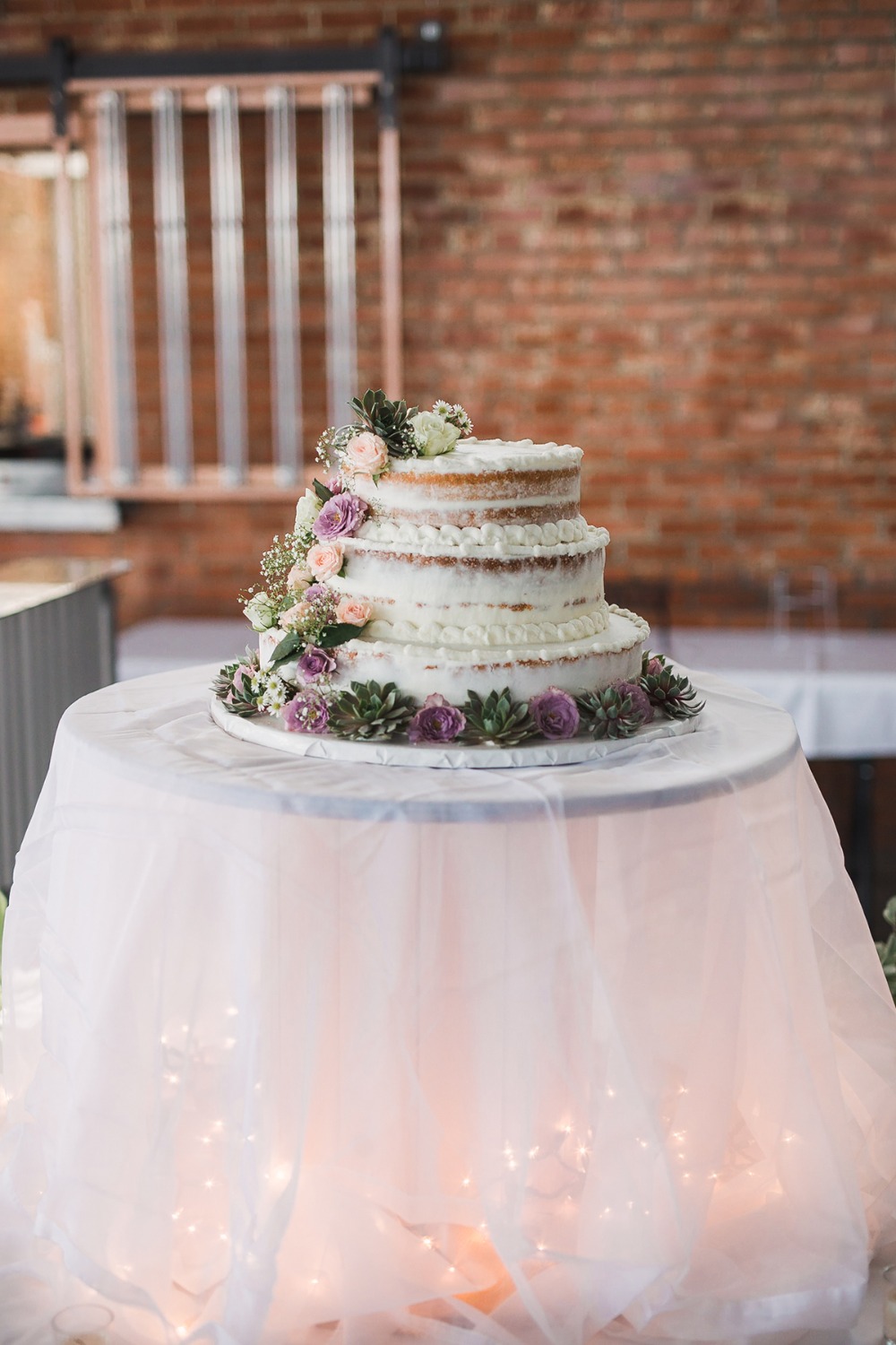 flower and succulent wedding cake