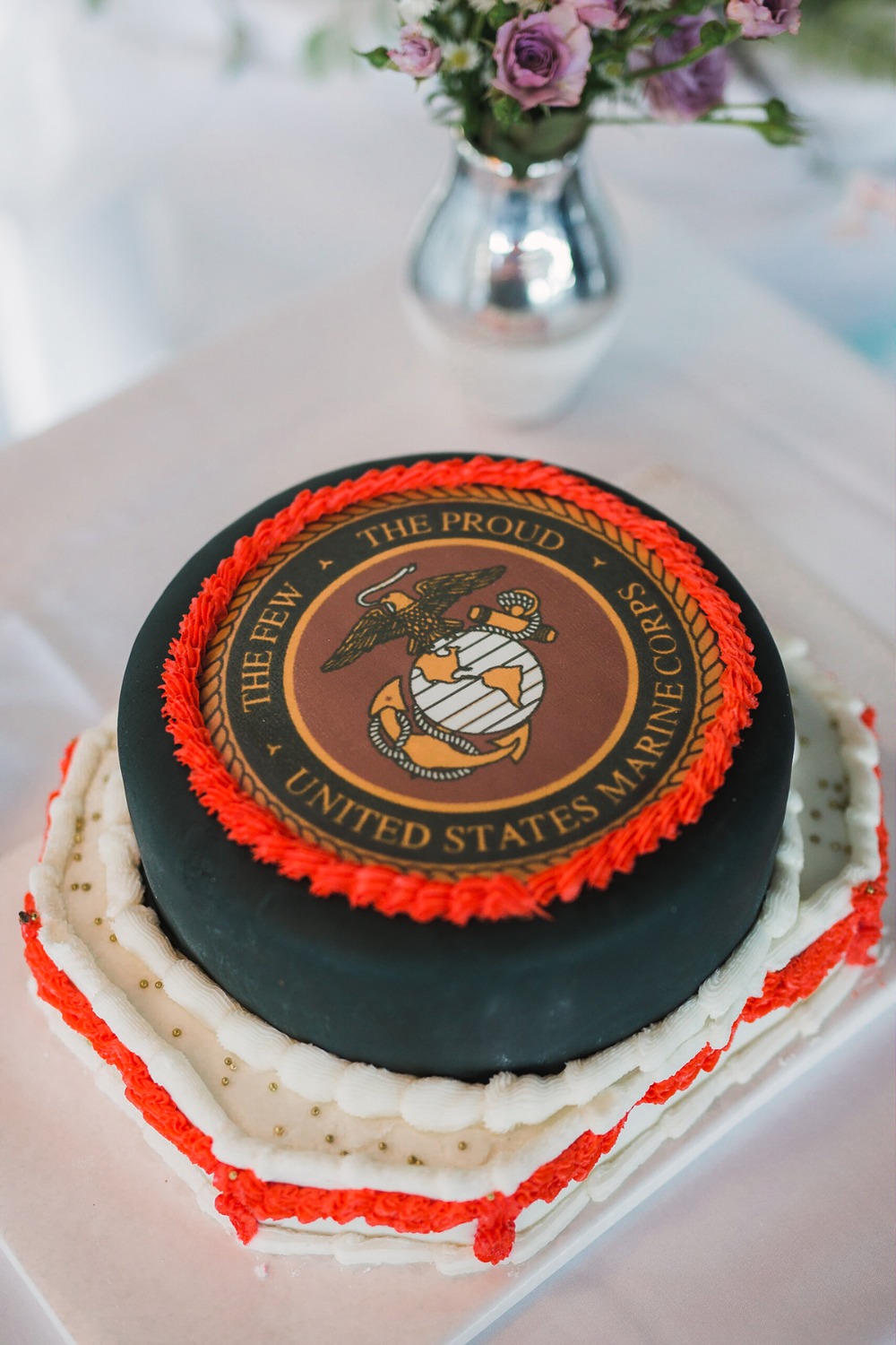 Marine Corps cake with a flower vase in the background