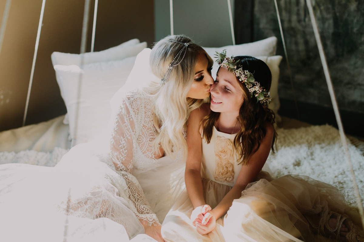 sweet wedding photo of bride and her flower girl