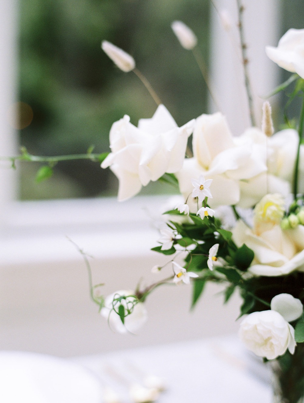 Elegant white floral arrangement with focus on intricate details
