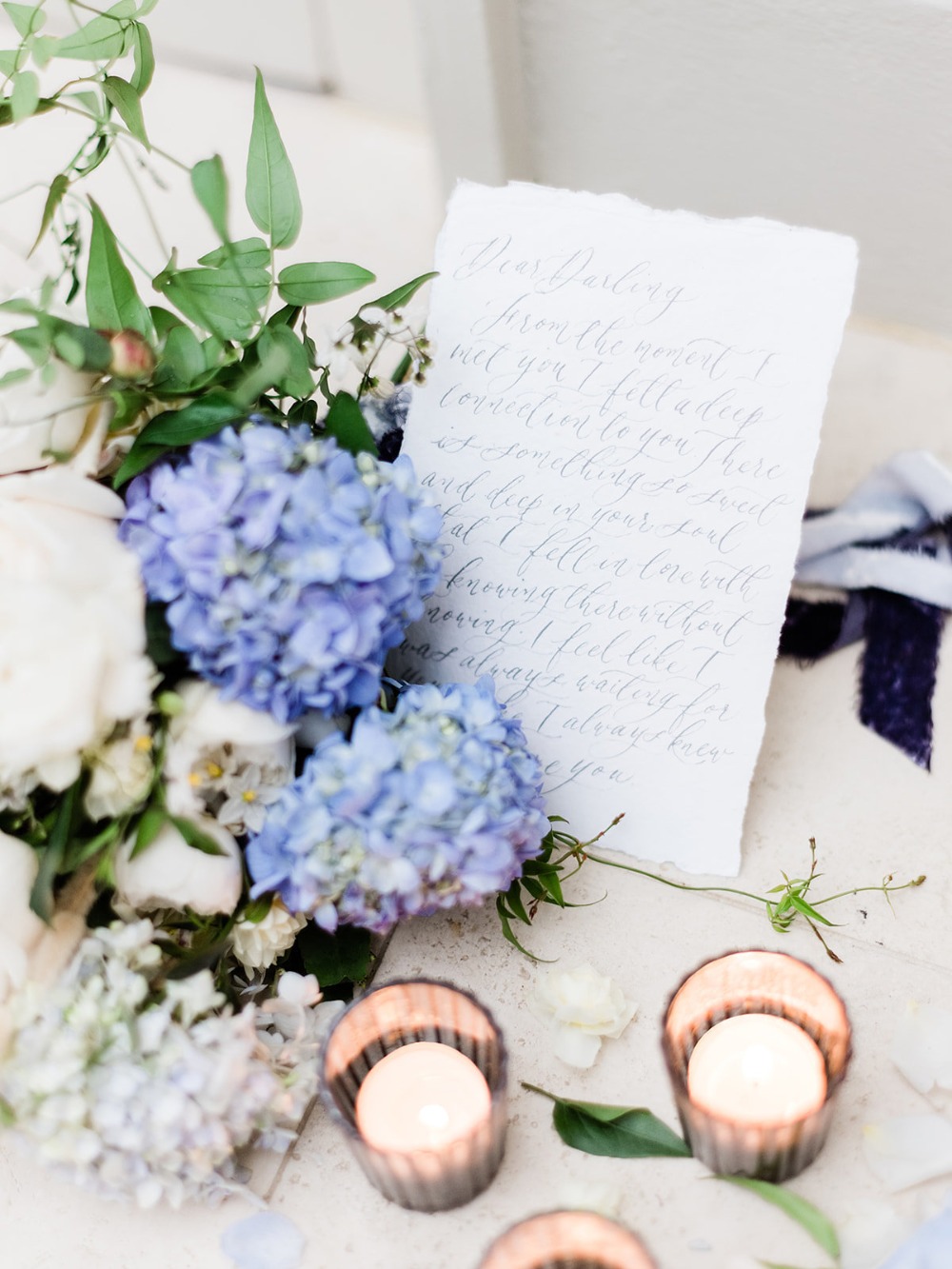 Elegant wedding details with flowers love letter candles