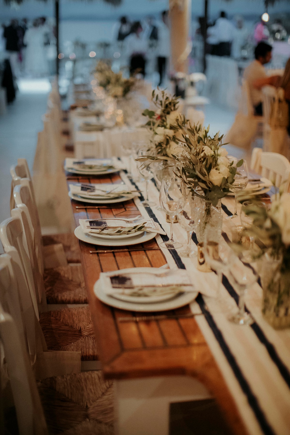 Elegant wedding reception table with white floral decor