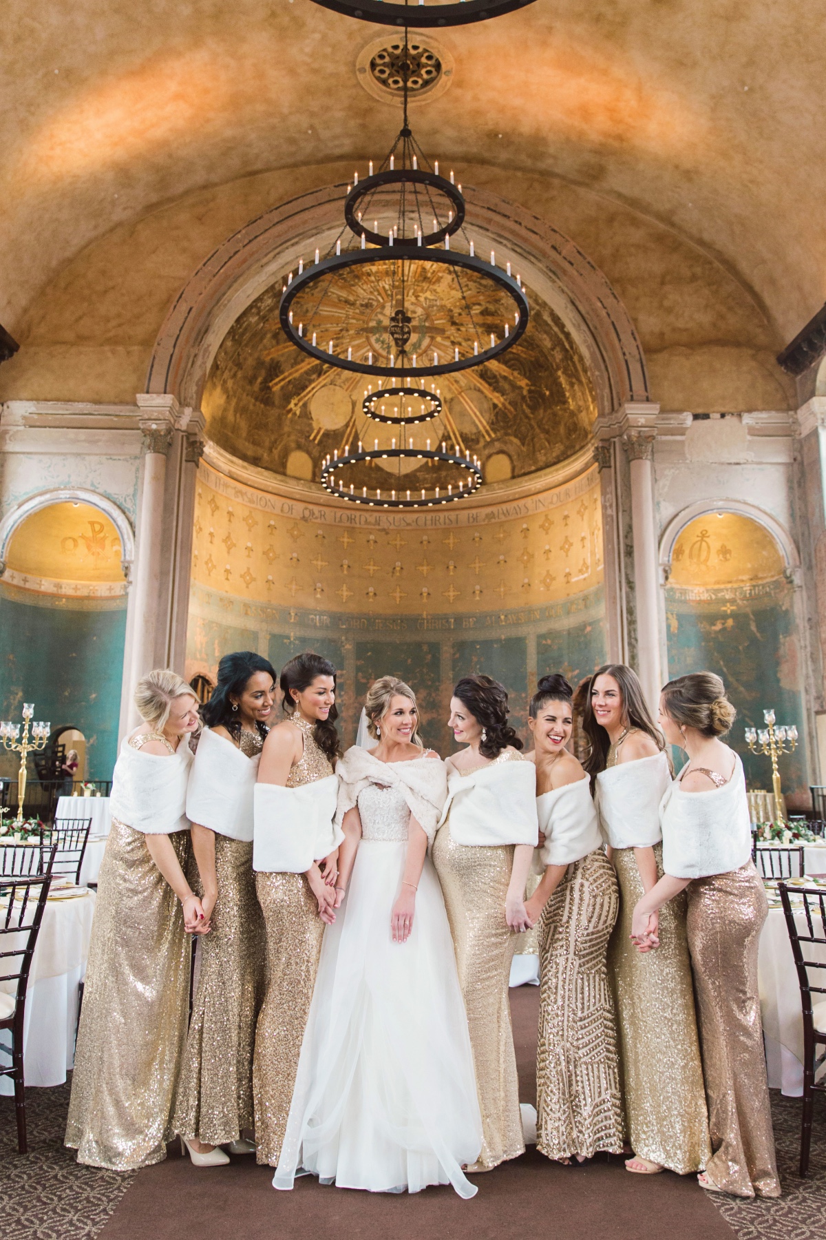 bridesmaids in fur shrugs and gold sequin gowns