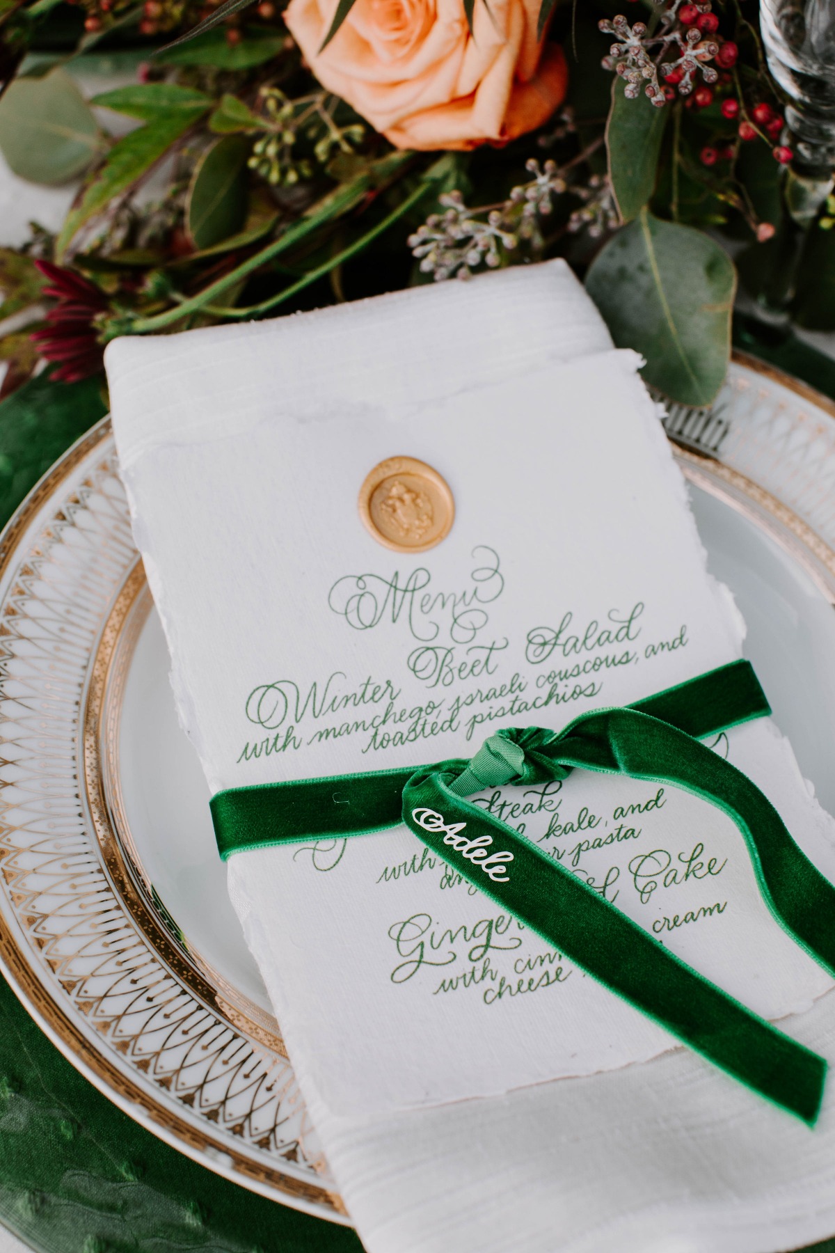 Emerald green and gold place setting for a wedding