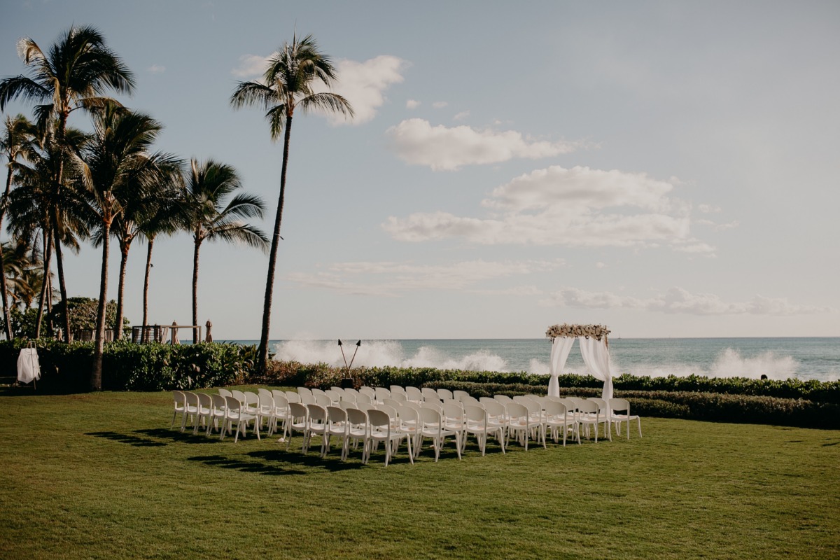 Tropical wedding venue with ocean backdrop and palm trees