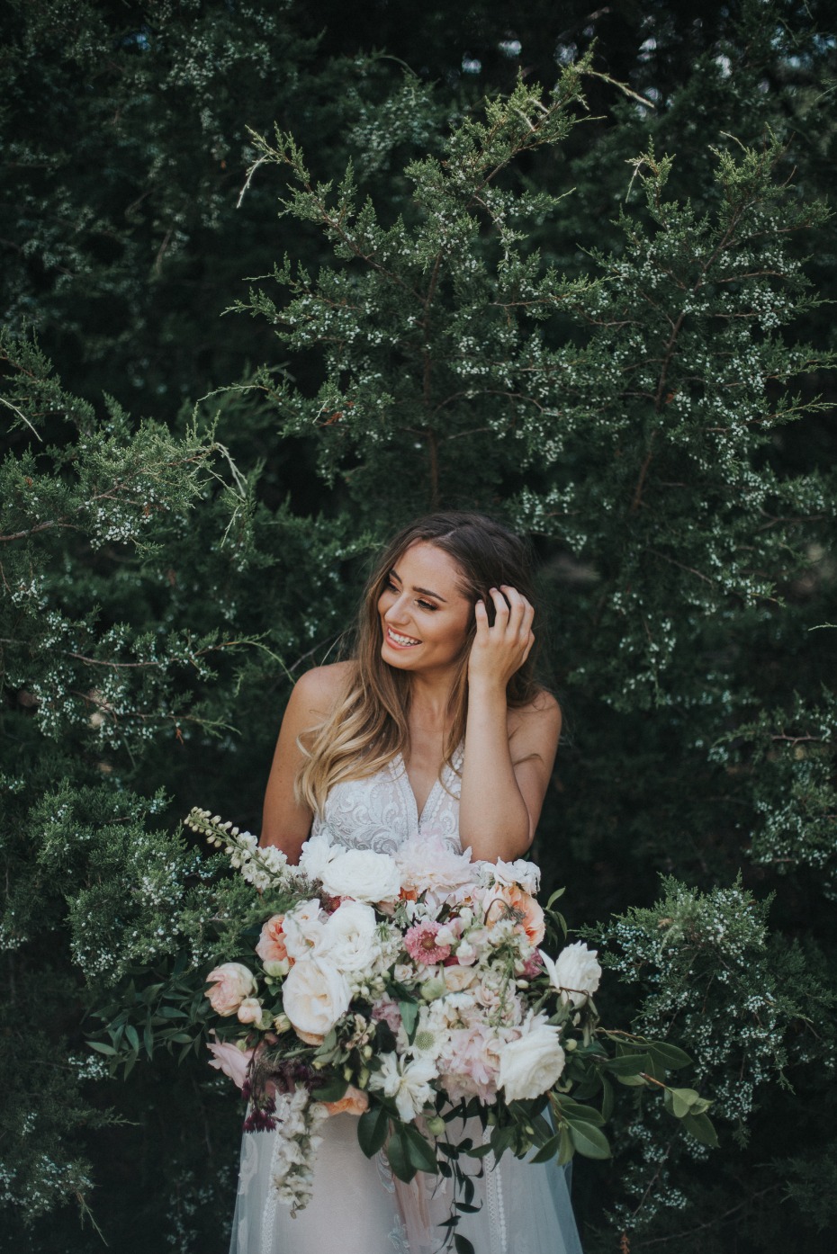 Wild Hill Flowers and Events Bride In Front of Trees with Bouquets