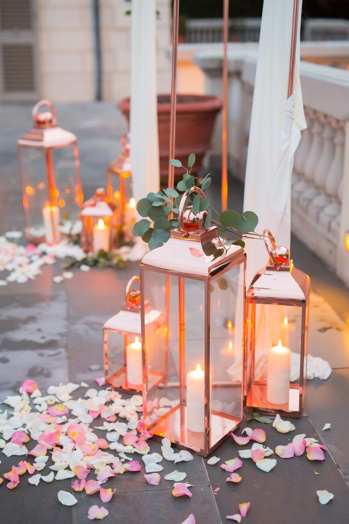 Romantic wedding decor with candles and rose petals