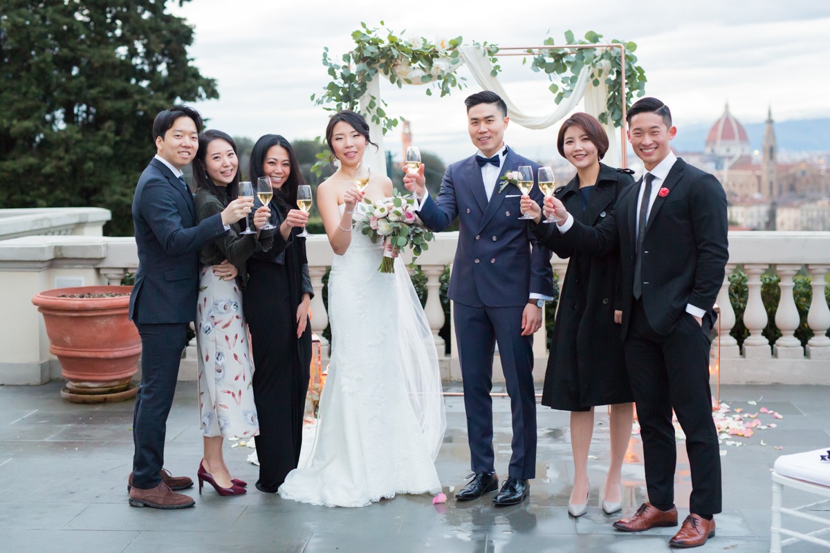 Wedding toast with bride groom and guests in Italy