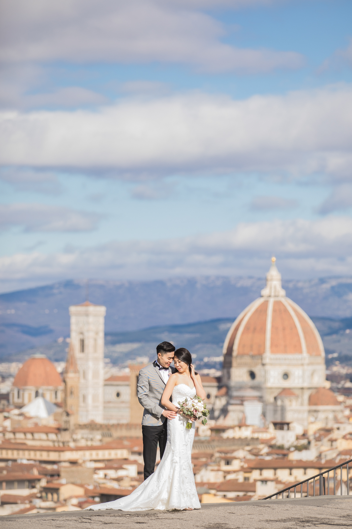 Happy couple poses for wedding photoshoot in Florence