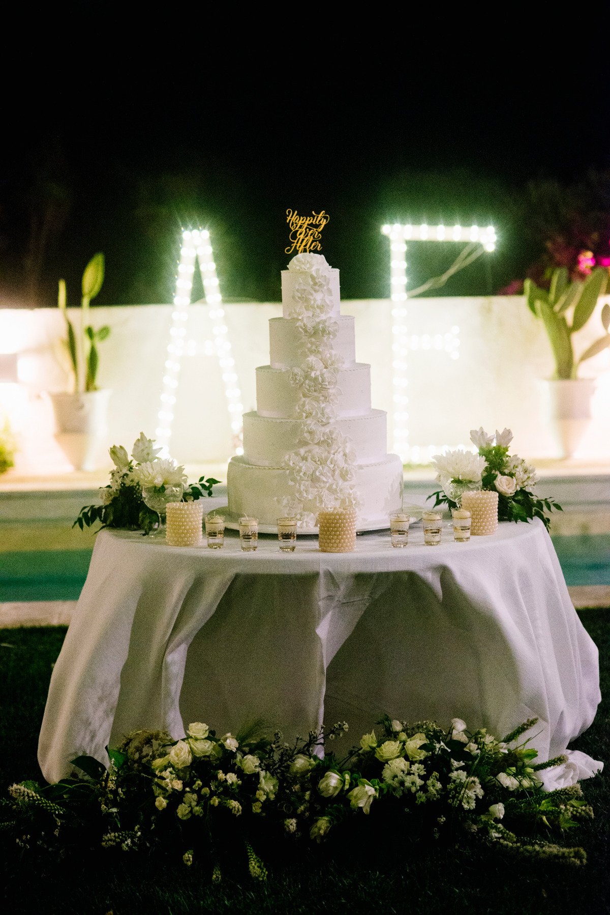 happily ever after topped wedding cake