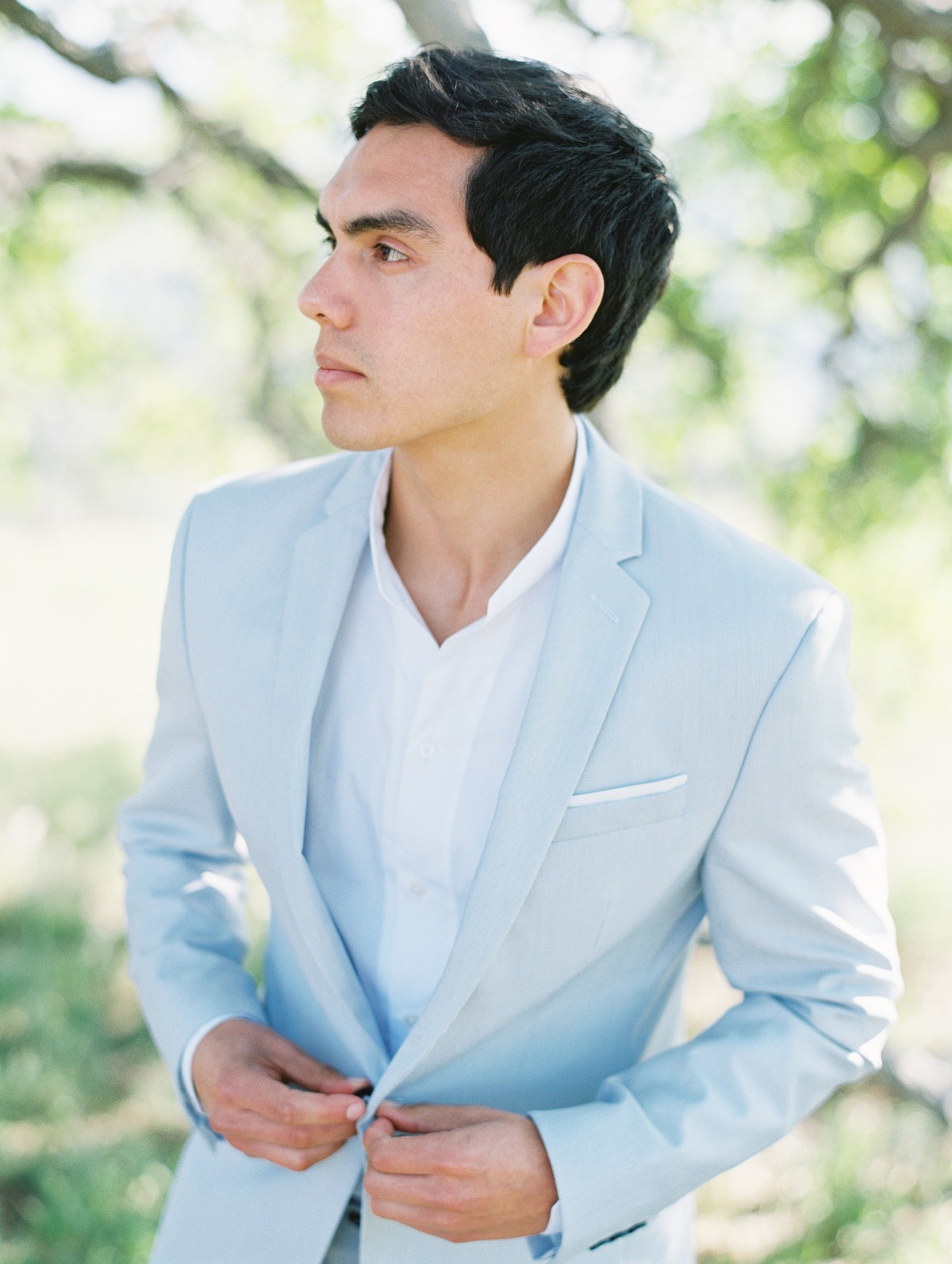 groom in light blue suit