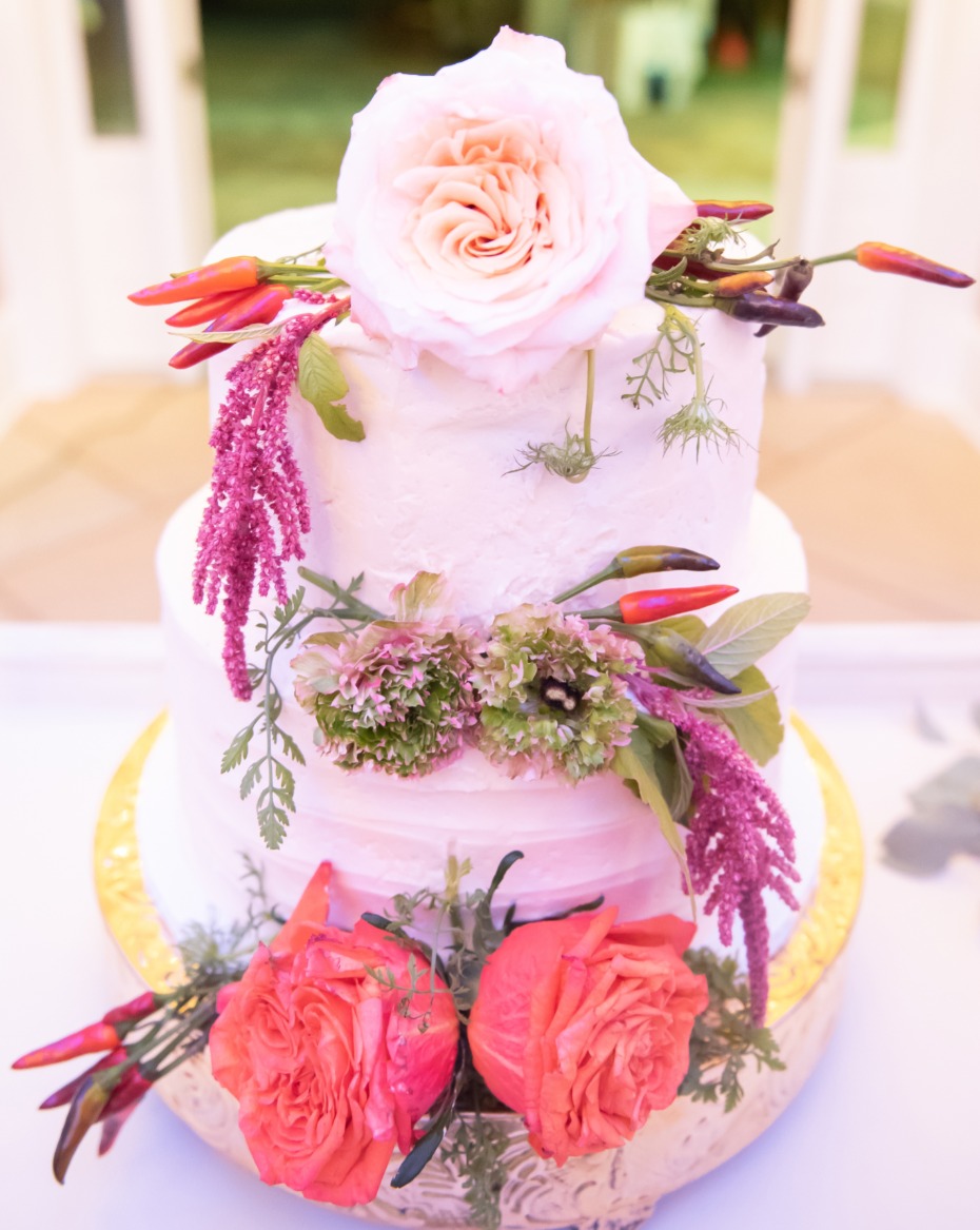 floral and pepper topped wedding cake