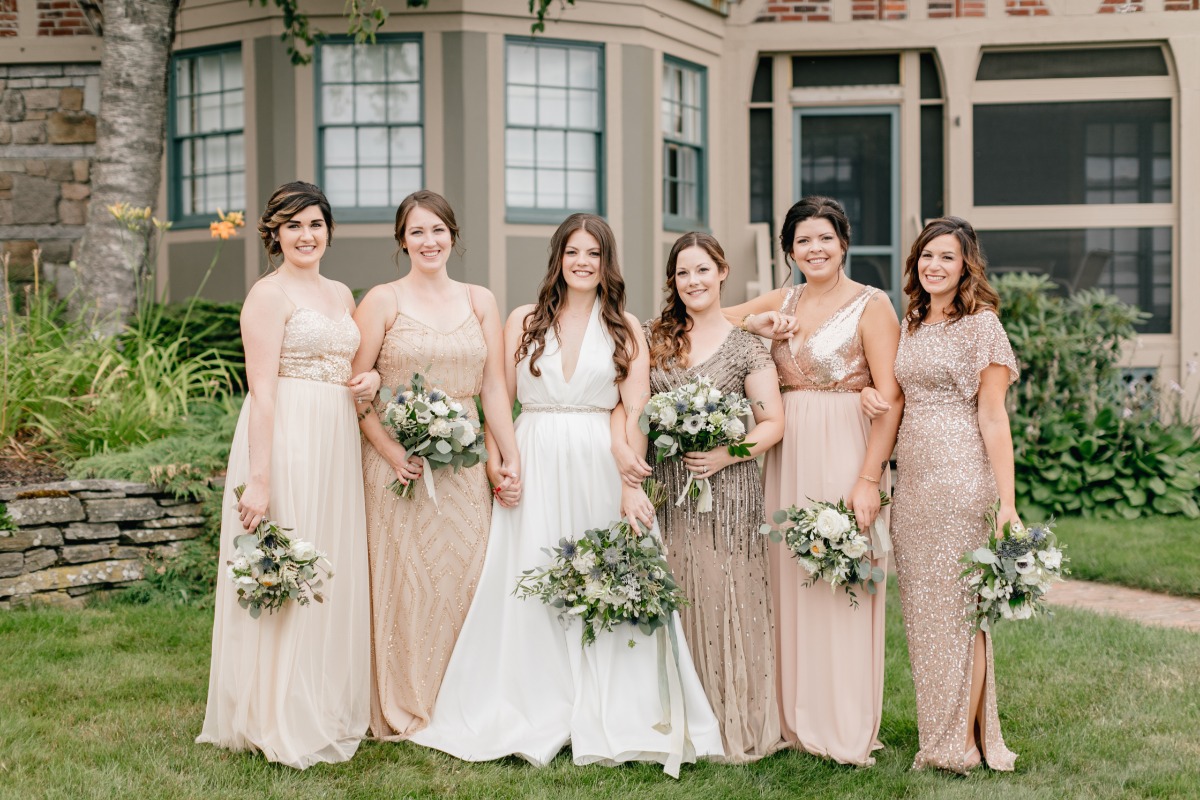 Bridesmaids in mix and match gold dresses