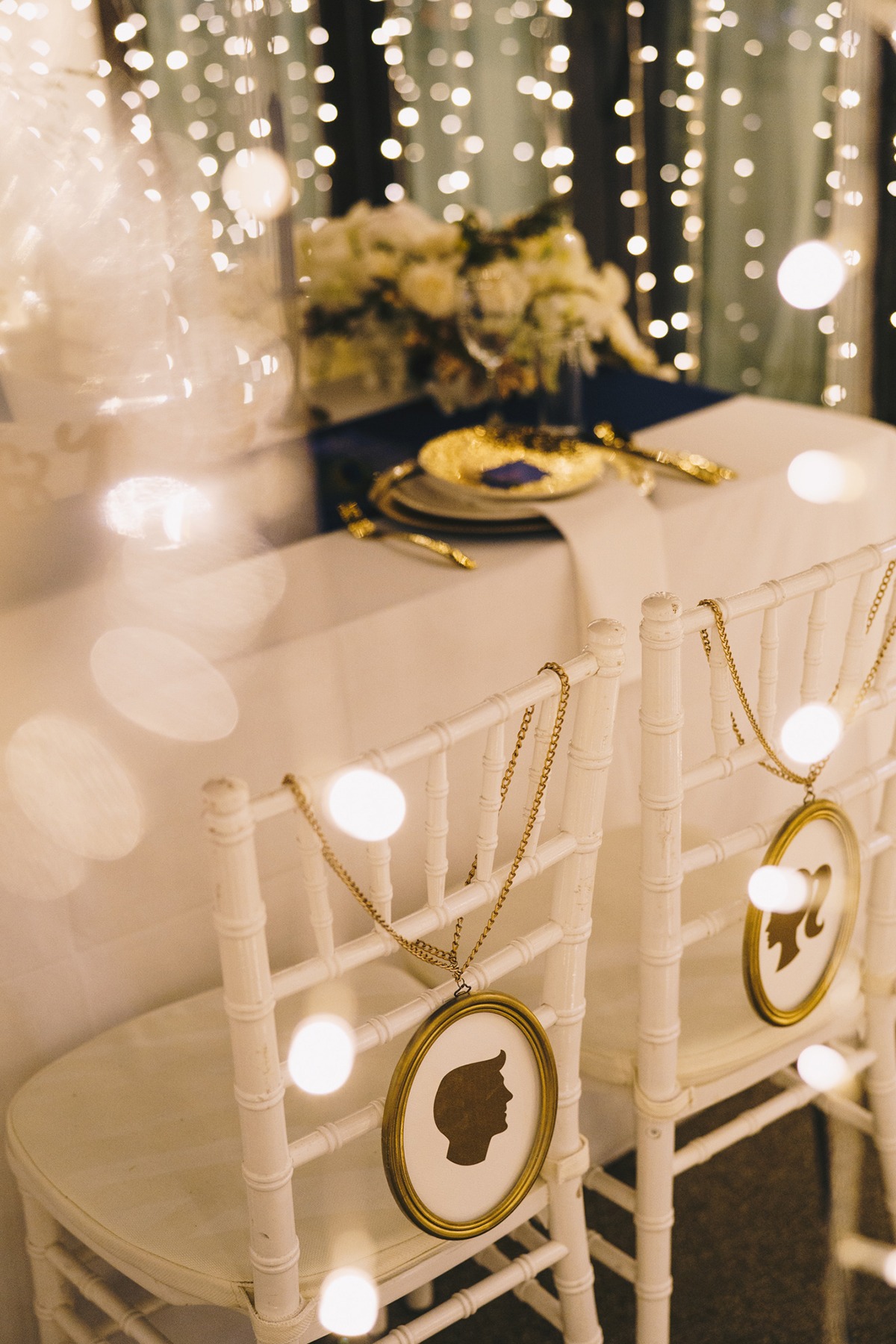 Elegant wedding table with decorative chairs and lights