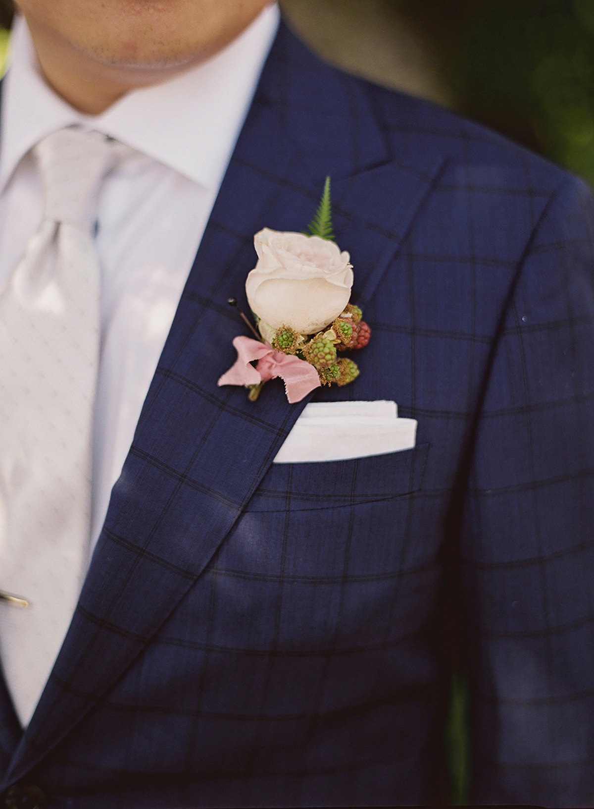 Checkered suit and boutonniere
