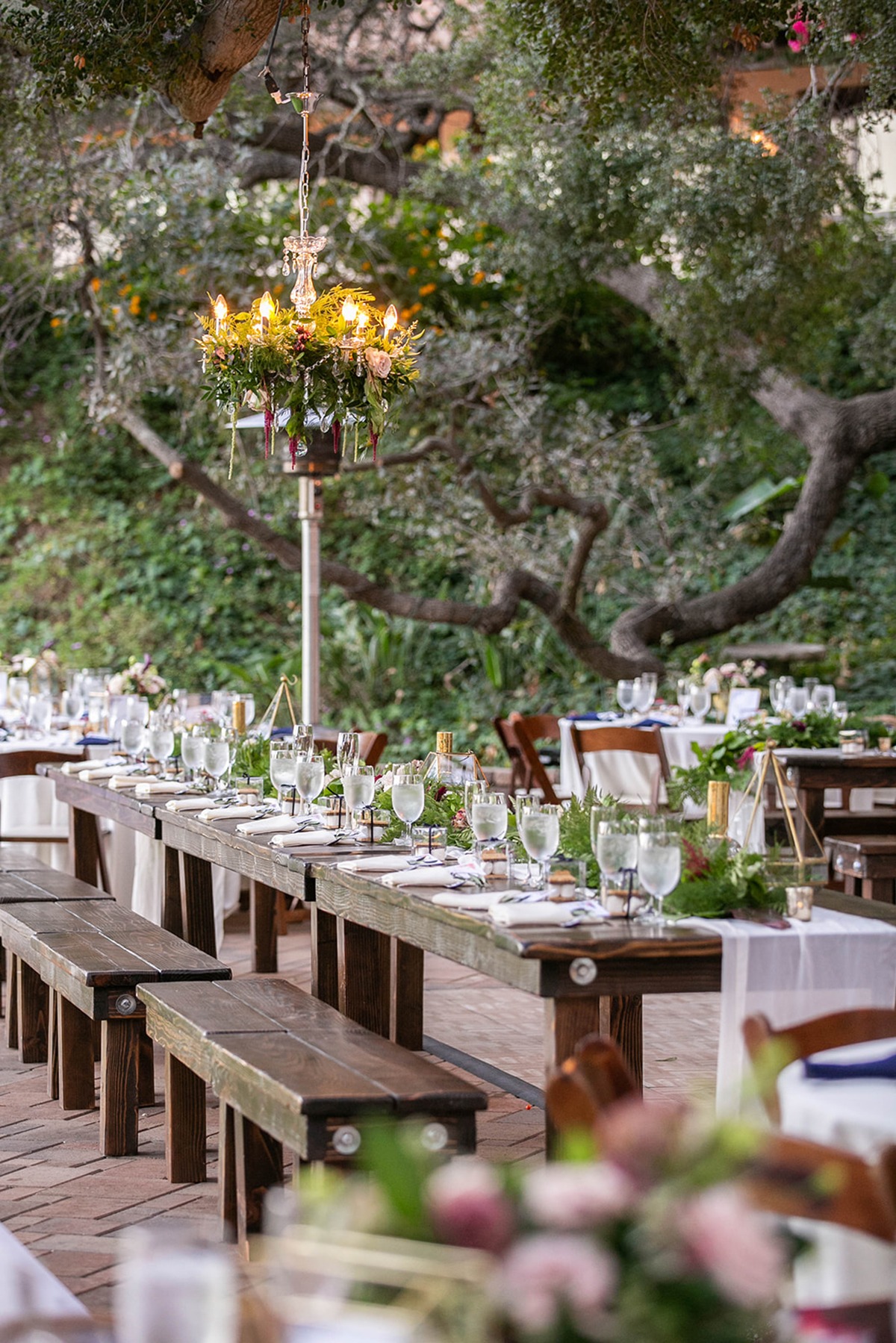 family style seating and outdoor chandeliers.