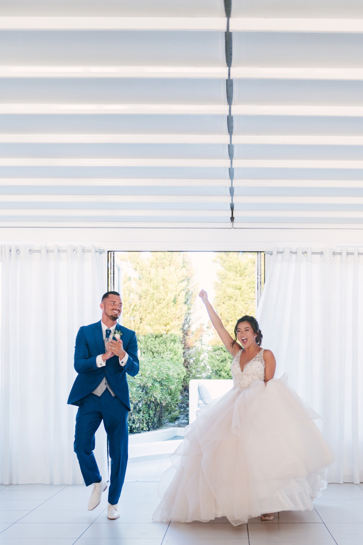 Joyful bride and groom celebrating at their wedding reception