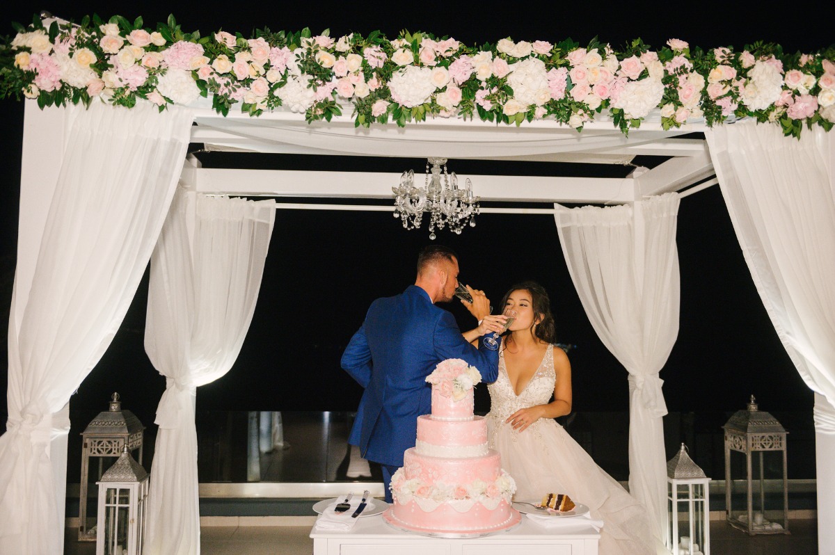 Romantic wedding celebration with couple toasting champagne glasses