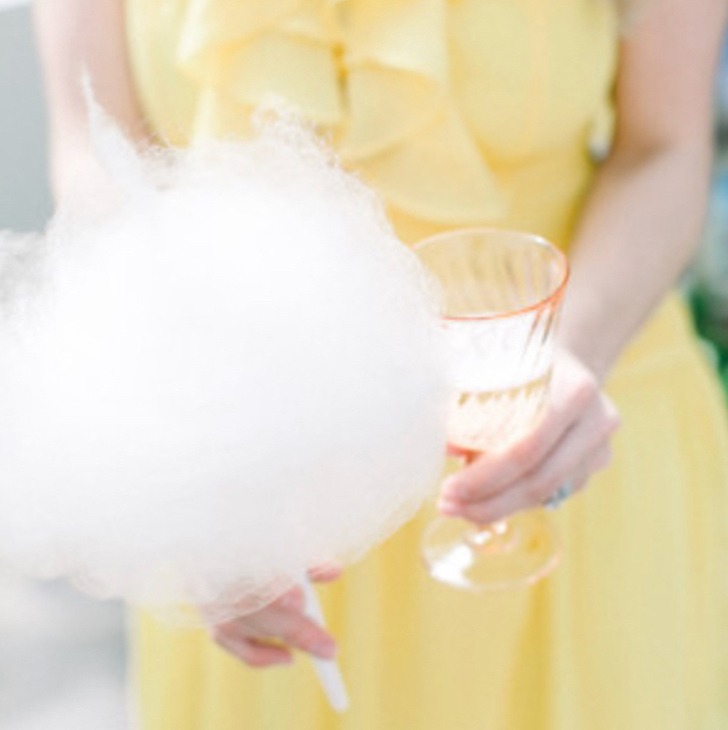 Wedding guest holding cotton candy