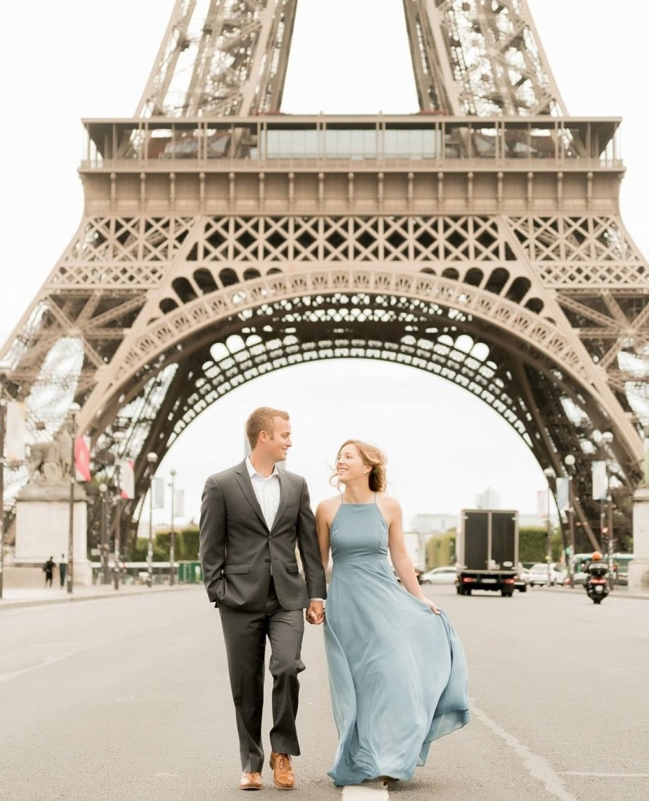 Couple strolling under the Eiffel Tower