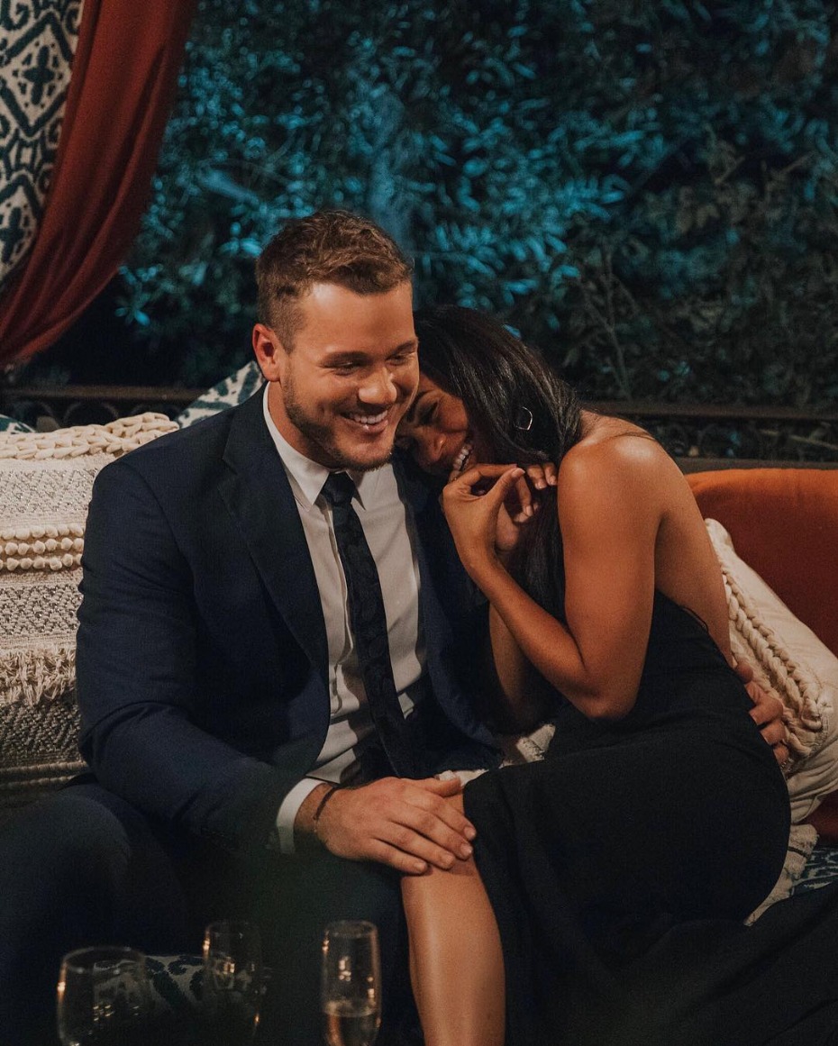 Smiling man and woman laugh on a romantic date night
