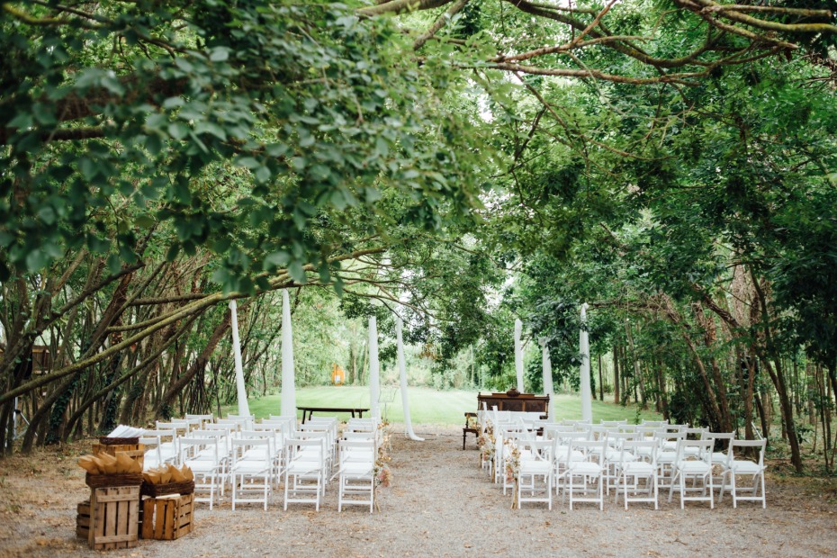Outdoor wedding ceremony in a green forest setting