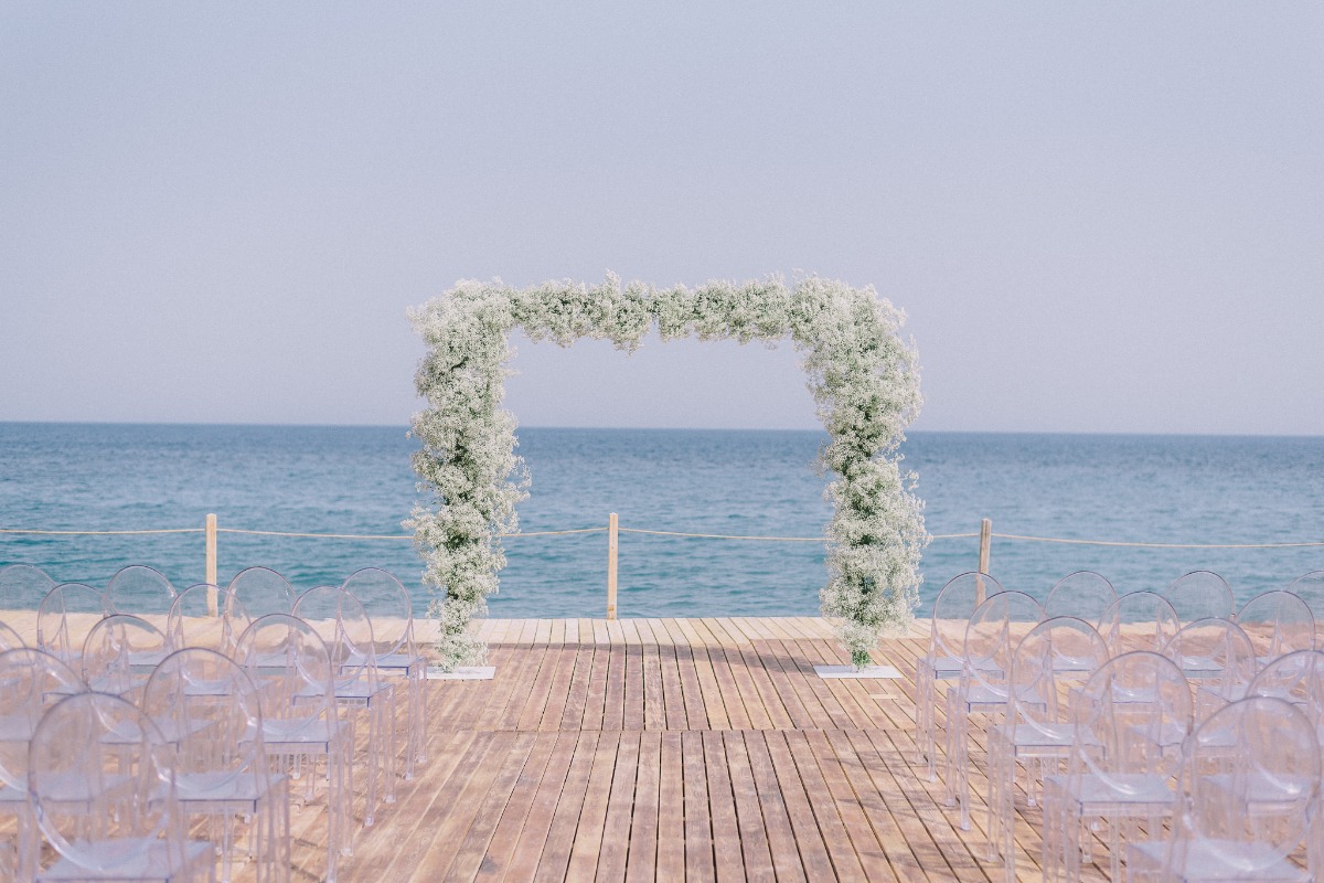 Babies breath ceremony arbor and acrylic chairs