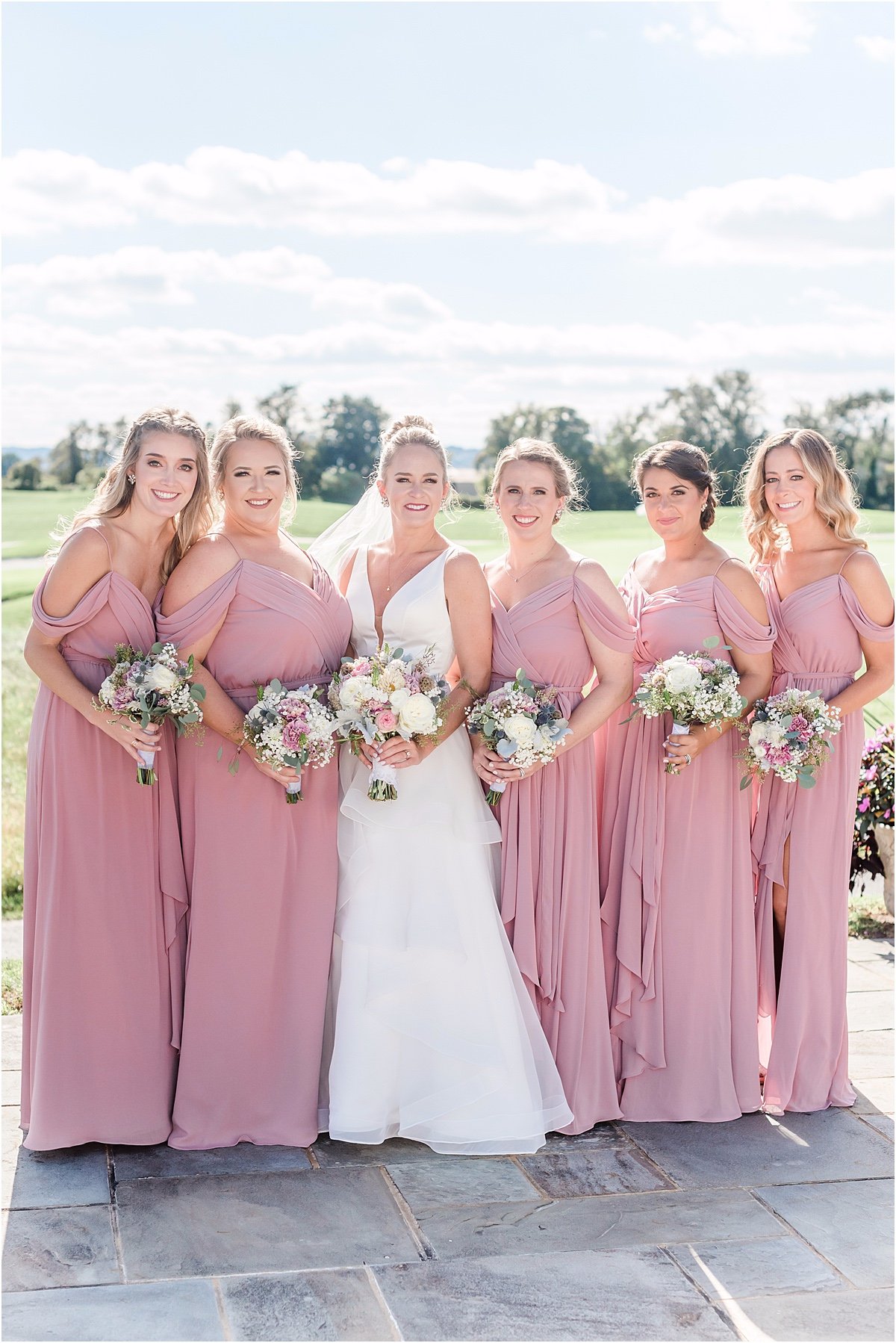 bridesmaids in floor length pink dresses