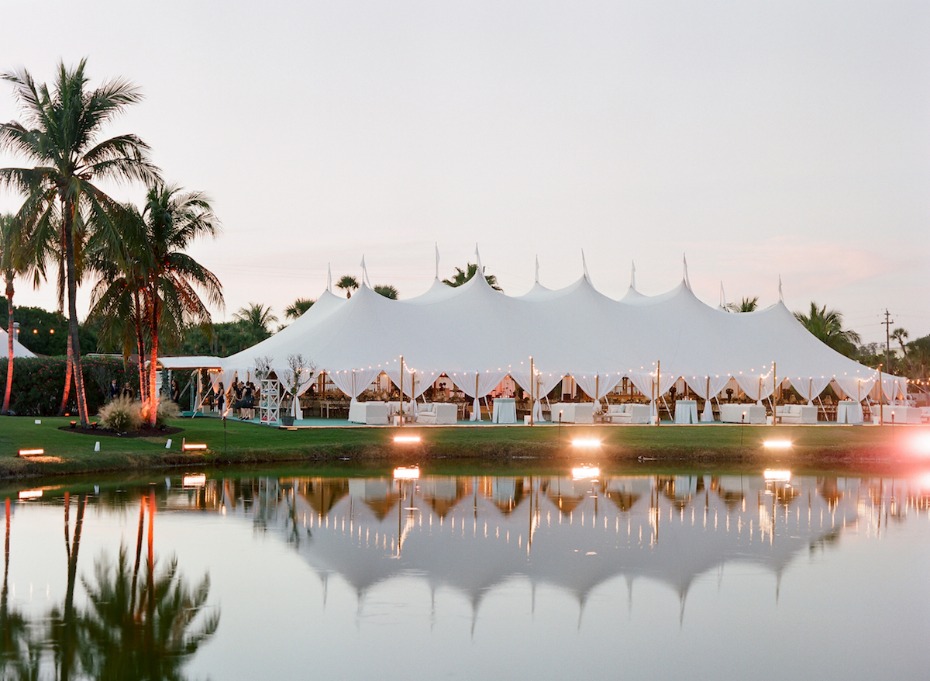 Sperry Tent reflection in the lagoon outdoor wedding