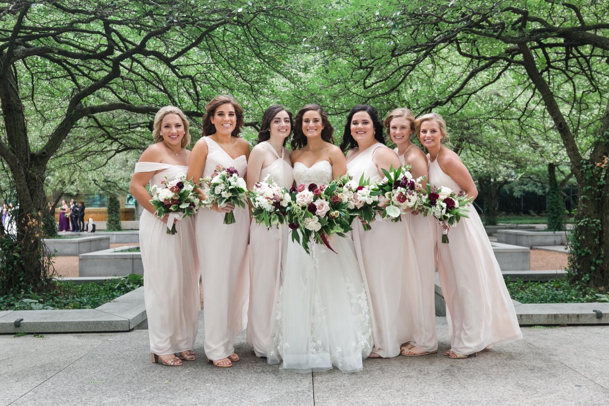 bridesmaids in subtle blush dresses