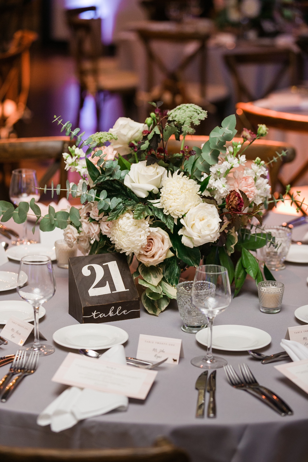 wood block table number and floral centerpiece