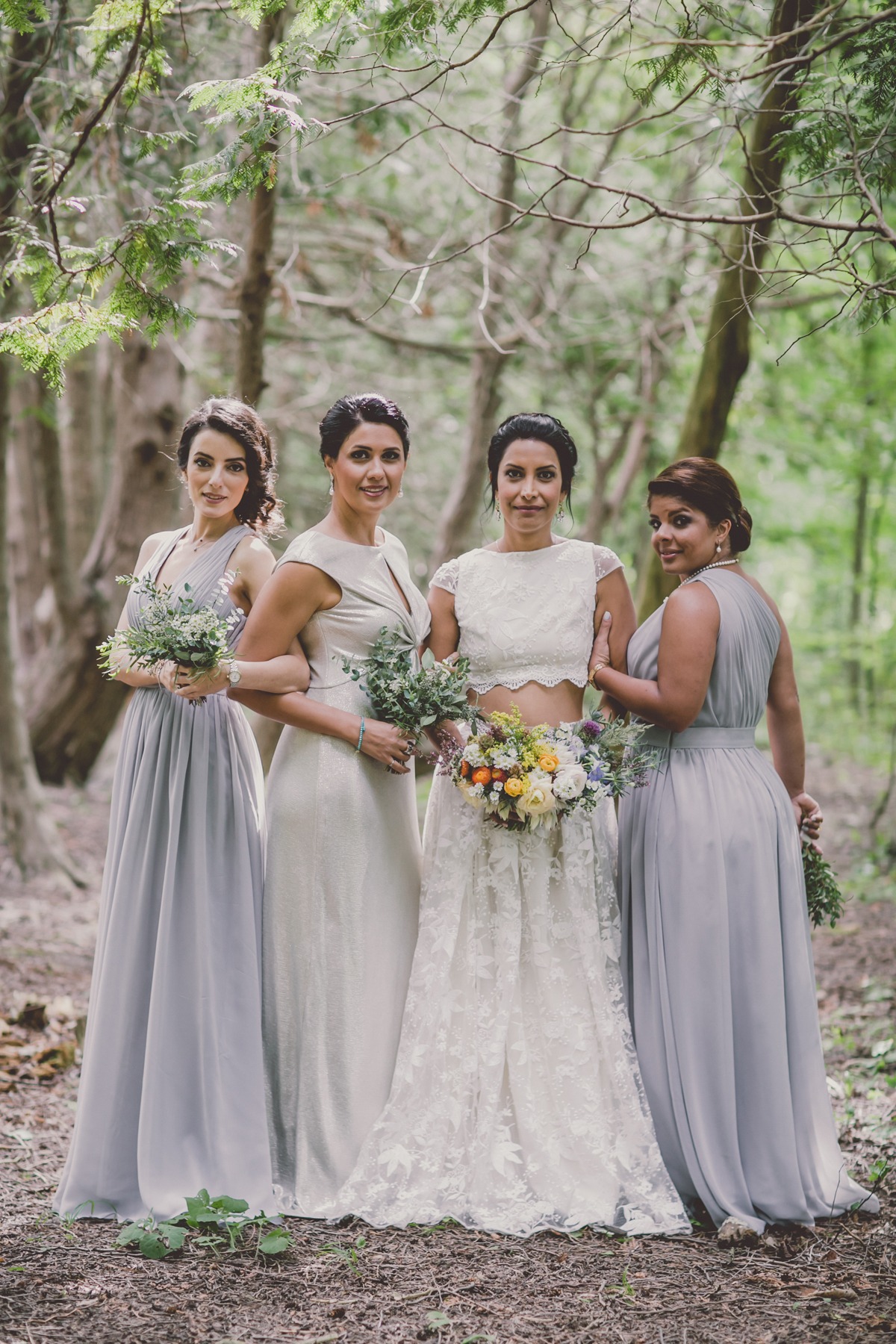 silver and grey bridesmaids and a two piece wedding dress