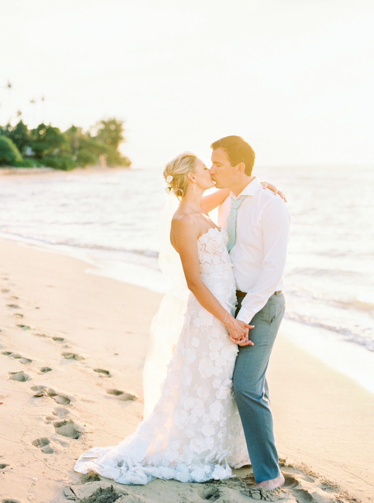 sunset beach wedding kiss
