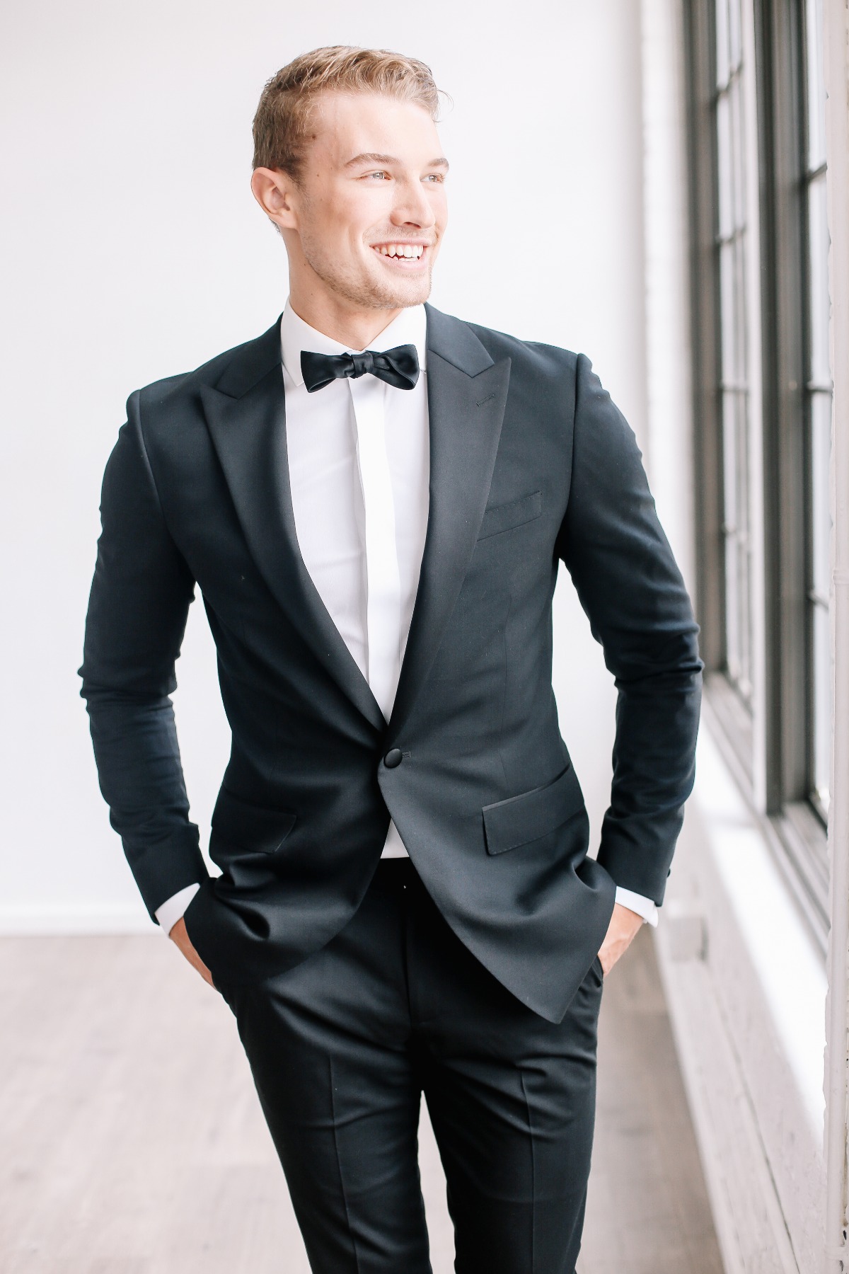 Stylish groom in black tie