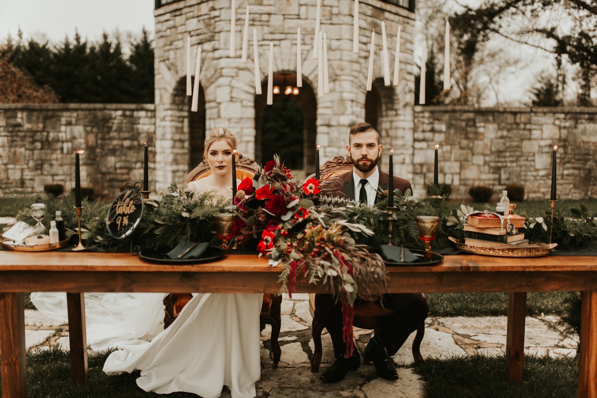 Bride and groom at Harry Potter themed wedding table