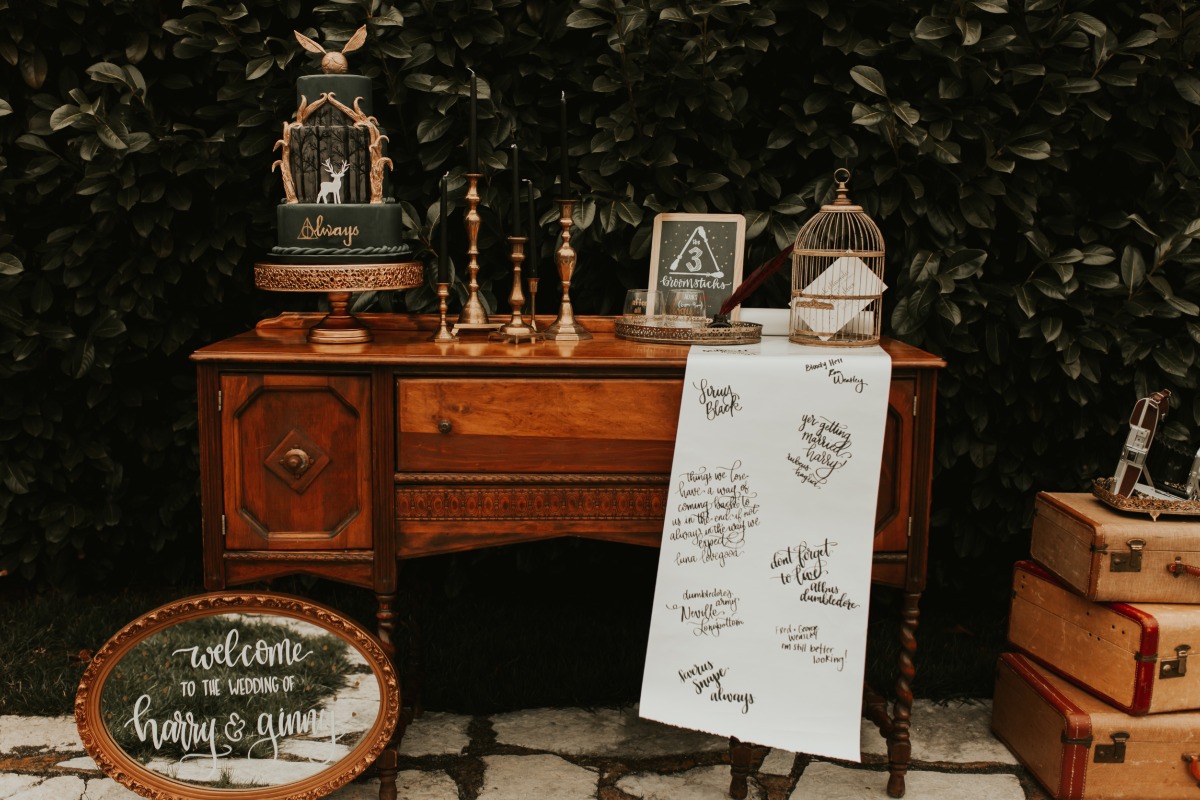 moody forest green and gold Harry Potter themed cake table