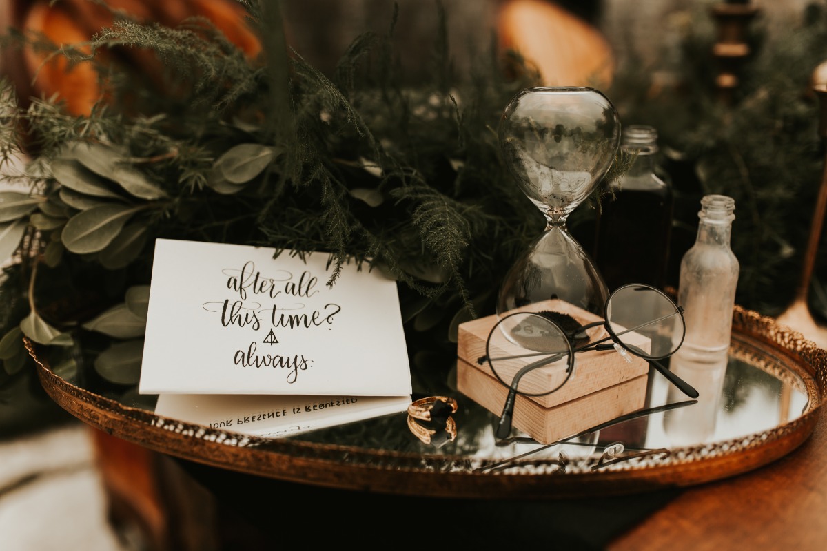 Harry Potter themed wedding decor with hourglass and glasses