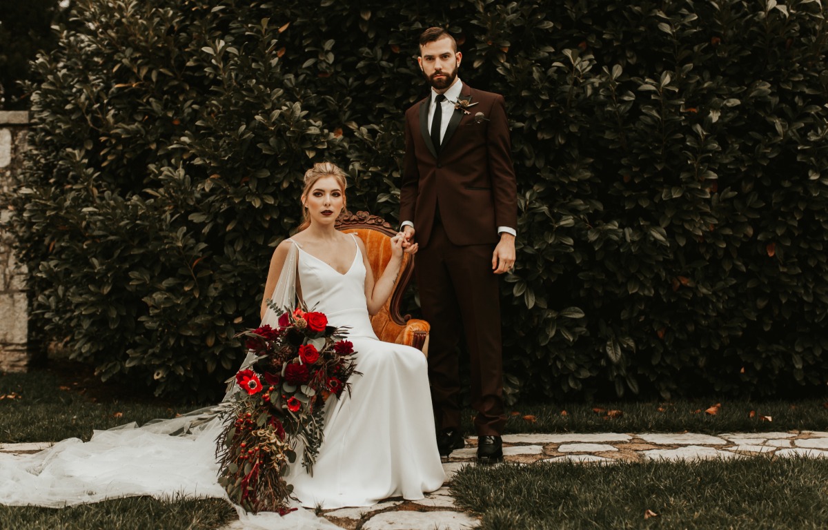 Elegant wedding portrait bride with dark red bouquet